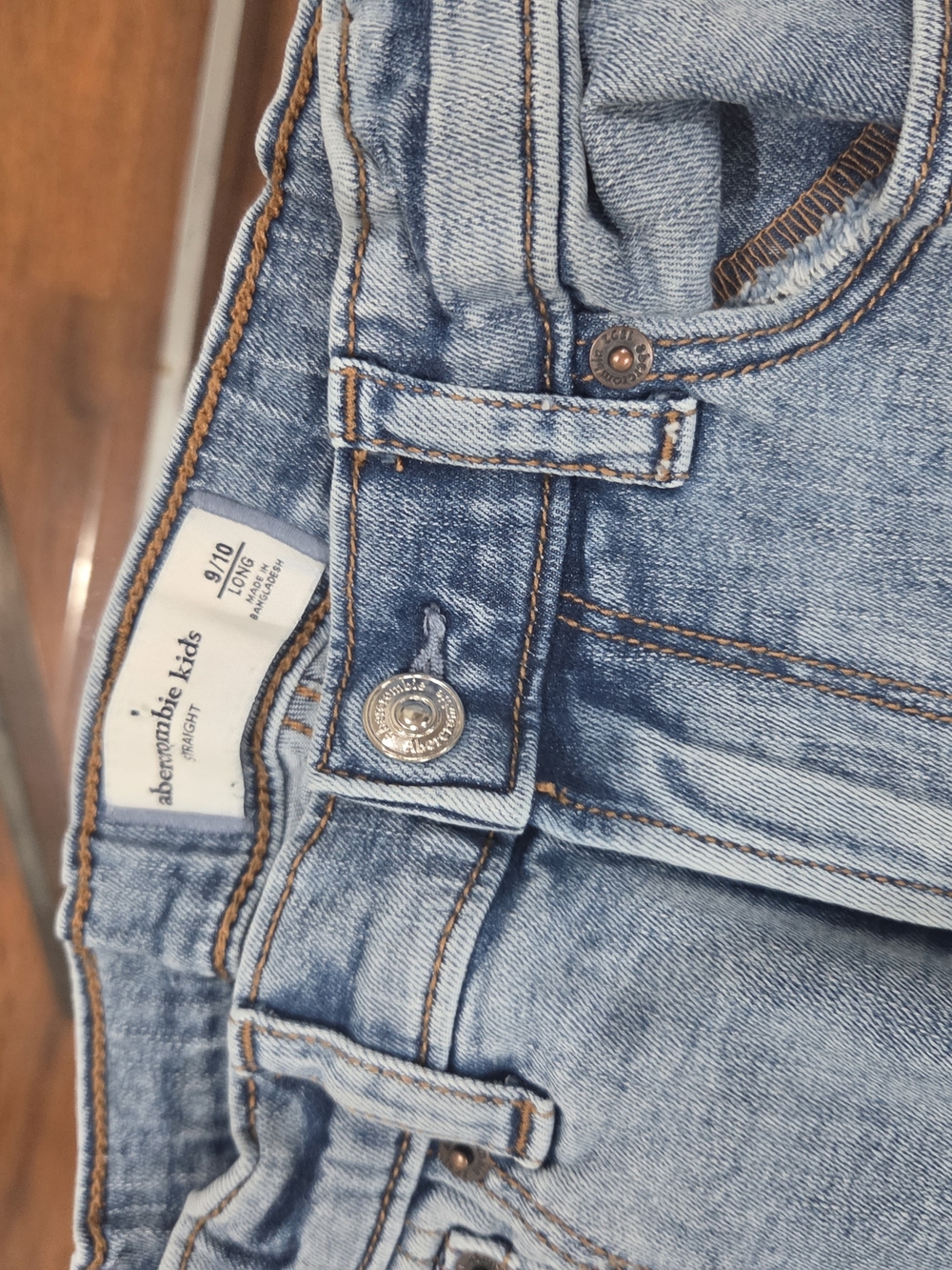 abercrombie kids light blue straight jeans with tan contrast stitching